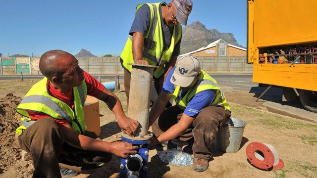 Municipal water department employees installing a new valve in Cape Town, South Africa