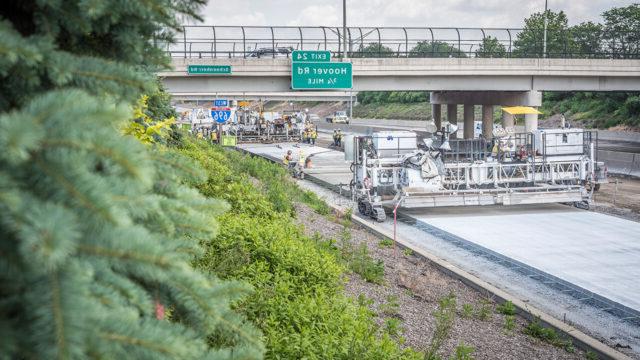 I-696 paving in area constrained by bridges and median outside barrier wall